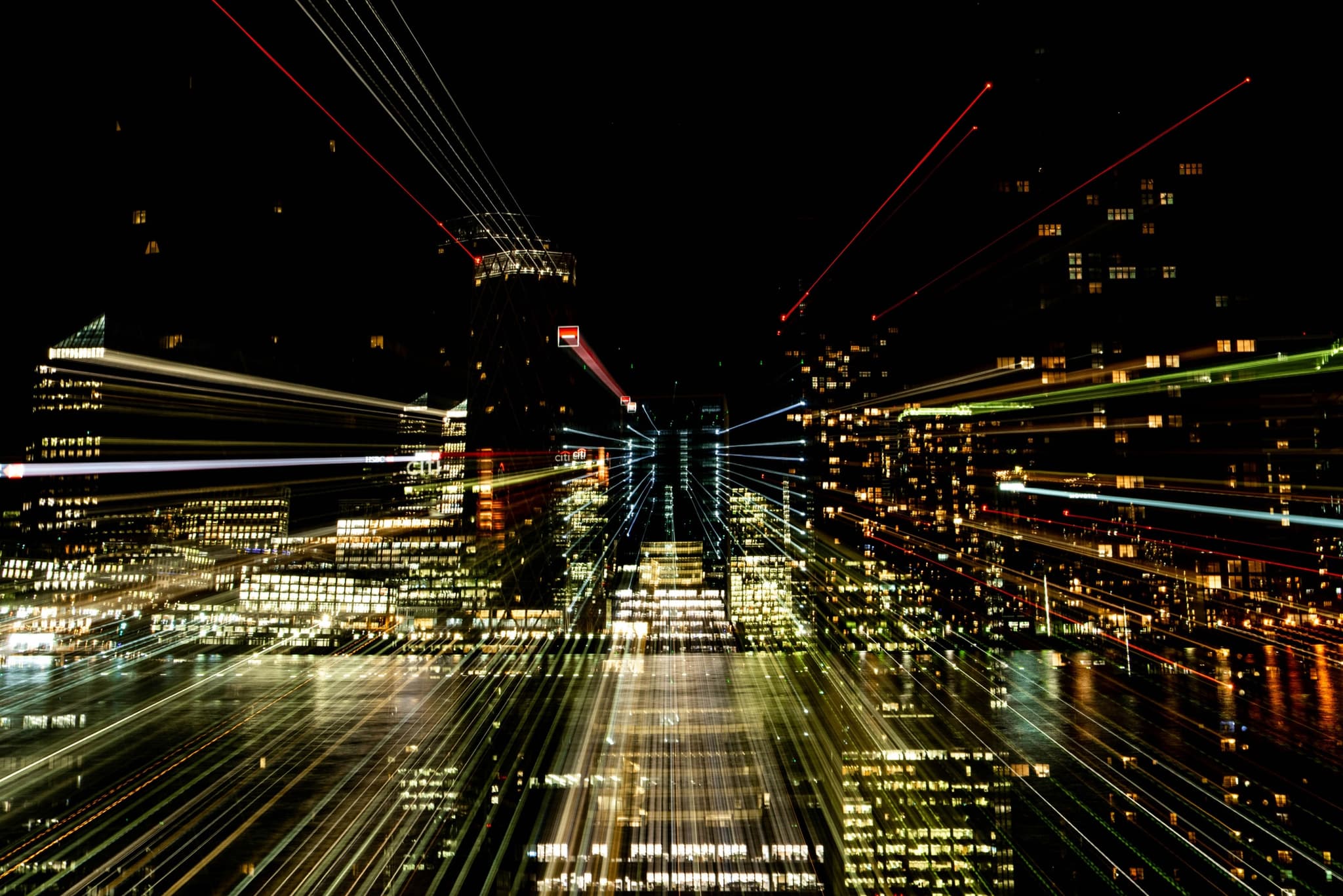 Long-exposure traffic trails through a night street