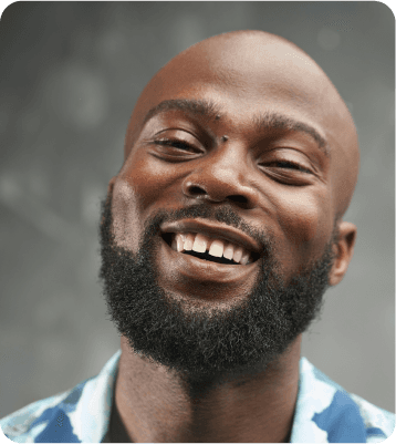 A man laughing, head tilted back