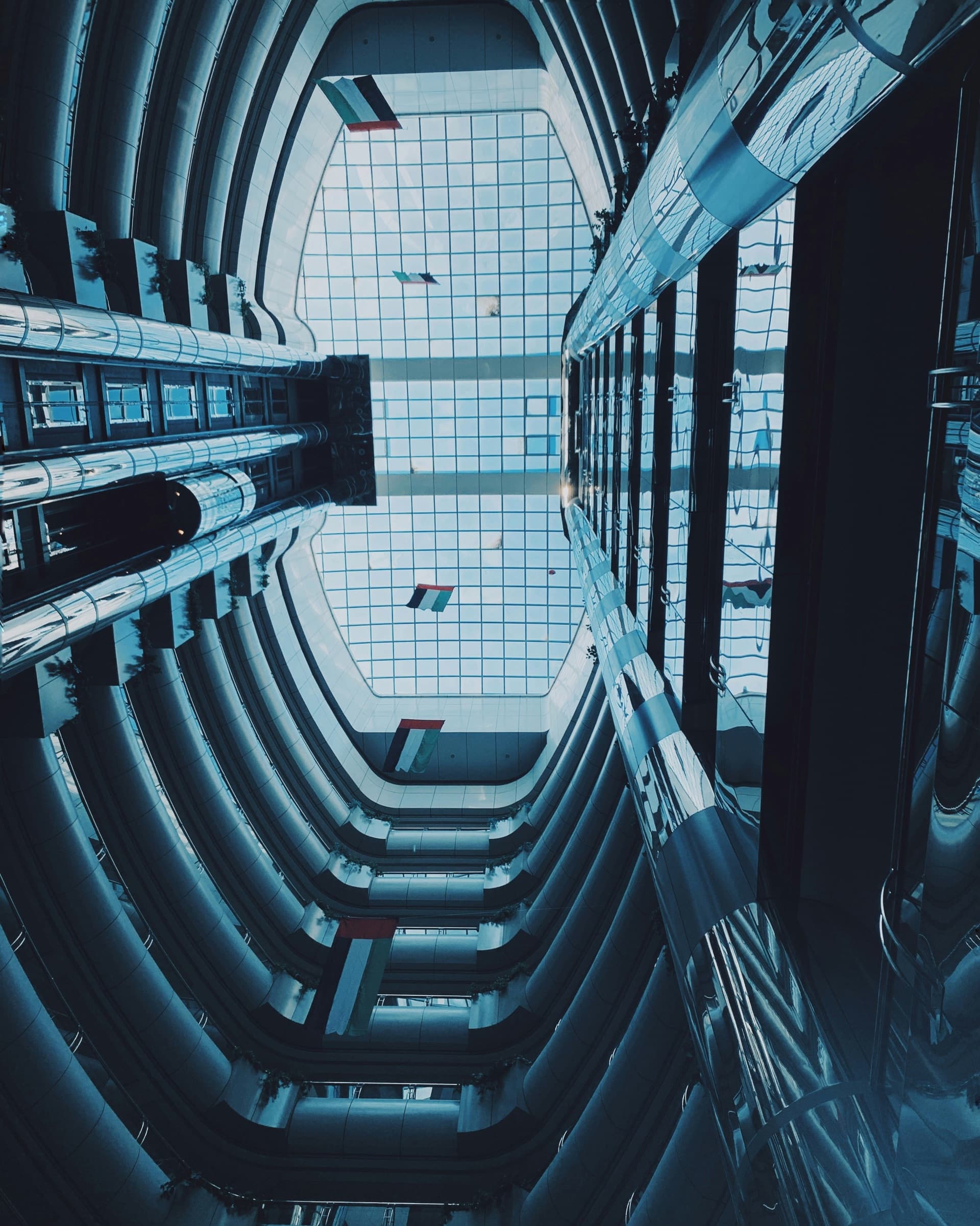 The curved glass facade of an office building